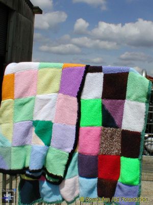 Knitted Blankets
Blankets assembled from knitted squares, a joint effort that produces a valuable gift.
Keywords: jun06;knits